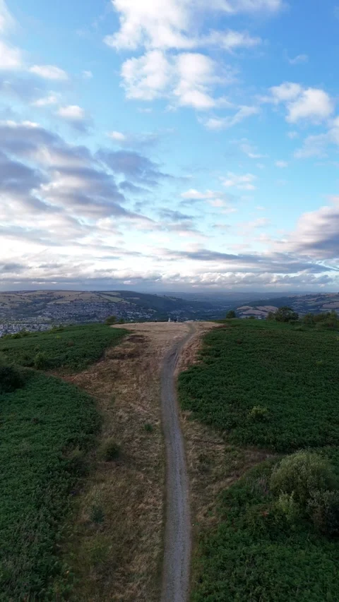 Aerial Drone View Over Caerphilly Mountain Beneath Dramatic Clouds, Wales Stock Footage 343577544