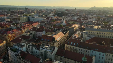 Aerial drone view over dense red-tiled historic rooftops with Gothic church Stock Footage 336610649