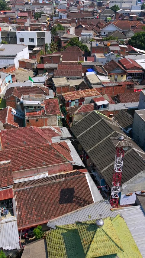 Aerial drone view over a dense residential neighborhood in Malang, Indonesia Stock Footage 345395860