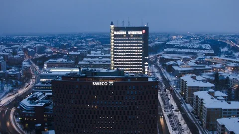 Aerial drone view over DN Newspaper building in Stockholm in winter at night Stock Footage 109484740