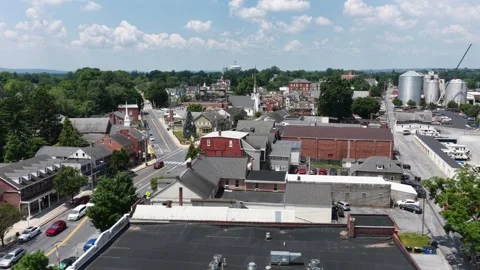 Aerial drone view over downtown Mount Joy, Pennsylvania, featuring small town Stock Footage 340396574