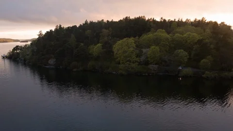 Aerial drone view over Forest and lake in Stockholm at sunset Vídeo Stock 109435737