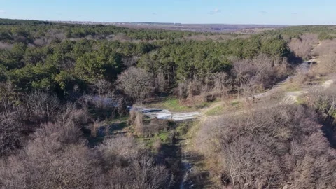 Aerial drone view over forest valley and rural countryside landscape Stock Footage 328006045