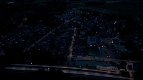 Aerial drone view over illuminated village at night Stock Footage 343838398