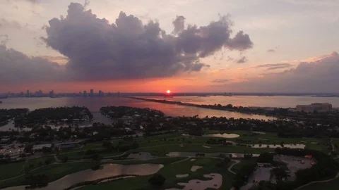 Aerial drone view over a large golf course in Miami Beach, sunset time Stock Footage 100865651