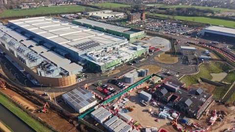 Aerial drone view over a large data centre construction site in England Stock Footage 330128744