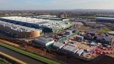 Aerial drone view over a large data centre construction site in England Stock Footage 330129094
