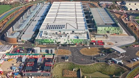 Aerial drone view over a large data centre construction site in England Stock Footage 330132555
