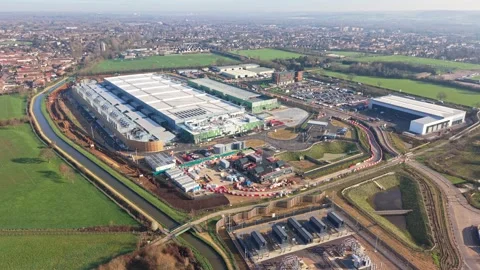 Aerial drone view over a large data centre construction site in England Stock Footage 330133891