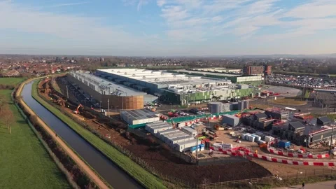 Aerial drone view over a large data centre construction site in England Stock Footage 330134041