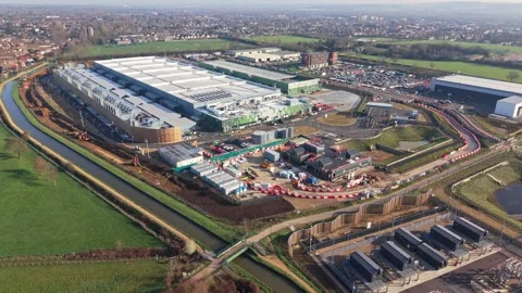 Aerial drone view over a large data centre construction site in England Stock Footage 330134093