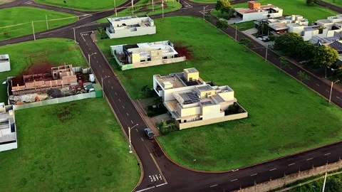 Aerial Drone View Over Modern Luxury Residential Neighborhood at Golden Hour Stock Footage 346794979