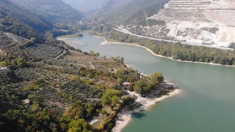 Aerial drone view over a river and fileds in Italy Stock Footage 113200631