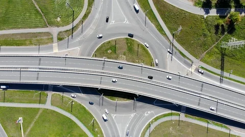 Aerial drone view over the road junction intersection. Traffic on flyover Stock Footage 129111807