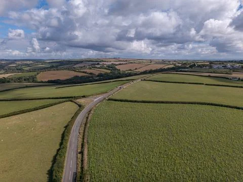 Aerial drone view over rolling green Cornish countryside farmland fields 스톡 사진