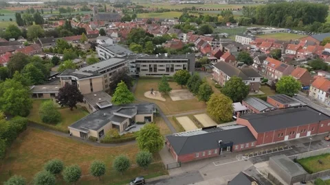 Aerial drone view over the Rusthuis retirement home complex in Ledegem, West Stock Footage 336575598