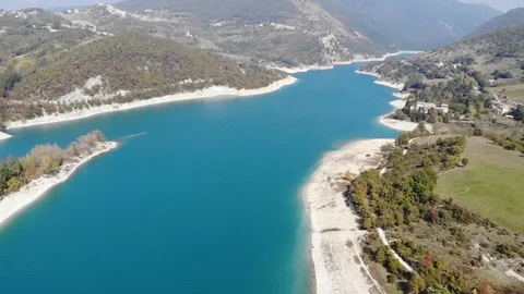 Aerial drone view over a turquoise river in Italy Stock Footage 113200671