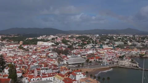 Aerial drone view overlooking the centre of Cascais, Portugal with a rainbow Stock Footage 300275175