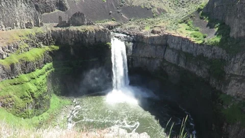 Aerial Drone View of Palouse Falls Plunging Over Basalt Cliff Into Canyon Pool Stock Footage 345858878