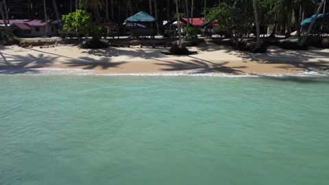Aerial drone view of Panaraga Beach with tropical jungle ocean waves and isl Vídeo Stock 343441819