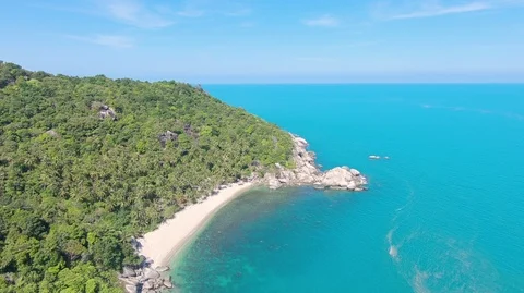 Aerial Drone View Panning Down on Haad Rin Secret Beach Koh Phangan Thailand Stock Footage 97645557