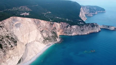 Aerial drone view with panning motion of wild beach Stock Footage 245543972