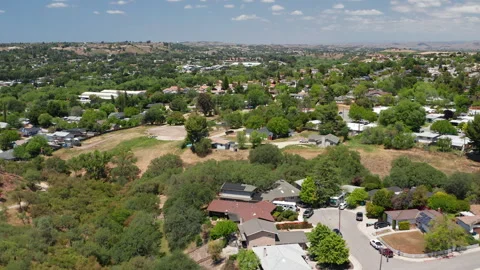 Aerial drone view of Paso Robles California suburb - homes, trees, hills 10 Stock Footage 308427485