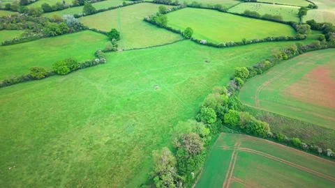 Aerial drone view of patchwork farmland fields and hedgerows in rural England Stock-Footage 336331782