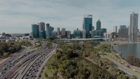 Aerial drone view of Perth CBD stretching along the Swan River, capturing the Stock Footage 344223126