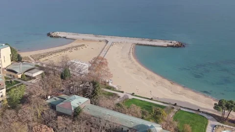 Aerial drone view of pier, sandy beach and calm turquoise sea Stock Footage 322537701