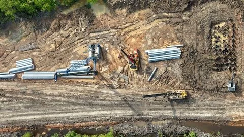 Aerial drone view of piling operation with crawler crane, pile driver, exca.. Stock Photos