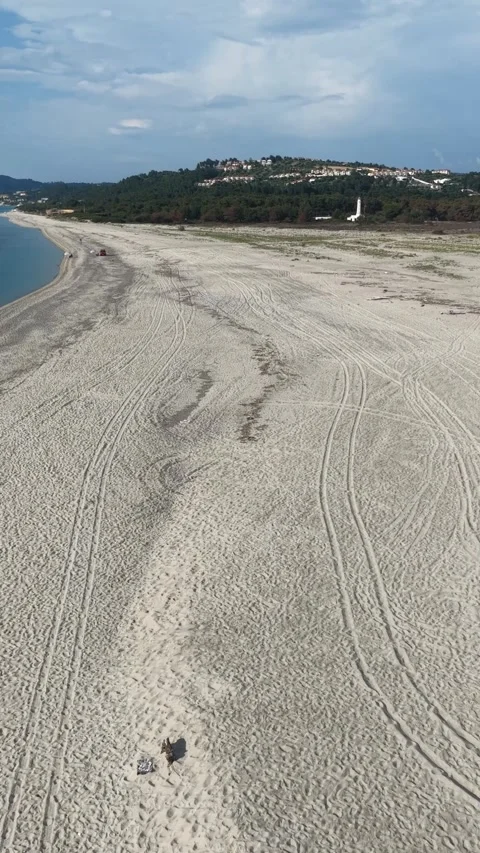 Aerial drone view of Possidi lighthouse and sandy beach in Halkidiki Greece Stock Footage 341461506