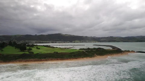 Aerial drone view of powerful ocean waves crashing onto sandy surf beach Vidéo 248885193