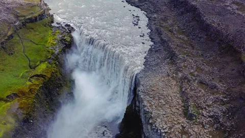 Aerial drone view of powerful waterfall cascading into rocky canyon Stock Footage 345467078