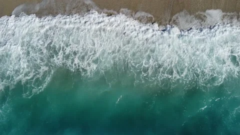 Aerial drone view of powerful waves crushing on tropical beach with yellow sand Stock Footage 161422398