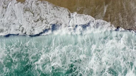 Aerial drone view of powerful waves crushing on tropical beach with yellow sand Stock Footage 161439382