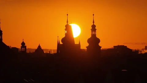 Aerial drone view of Prague old town church spires and red rooftops bathed in Stock Footage 336602383