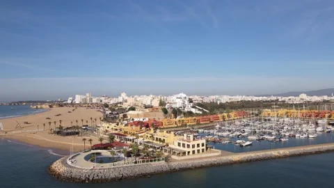 Aerial drone view of Praia da Rocha and marina in Portimao Stock Footage 167924024