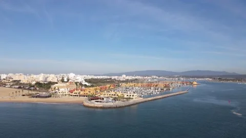 Aerial drone view of Praia da Rocha and marina in Portimao Stock Footage 167924083