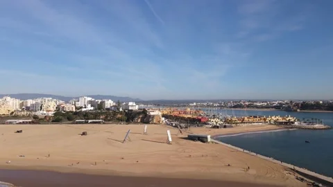 Aerial drone view of Praia da Rocha and marina in Portimao Stock Footage 167924094