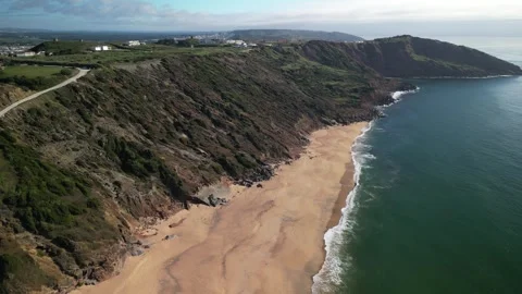 Aerial drone view of Praia da Gralha revealing Sao Martinho do Porto, Portugal Stock Footage 276296400