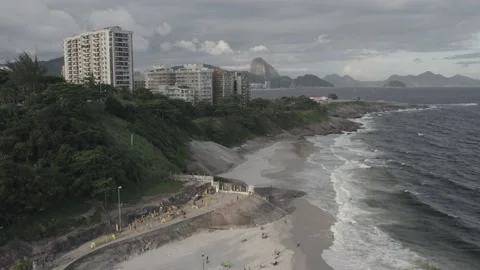 Aerial drone view of Praia do Diabo with Copacabana beach in the background in Stock Footage 231536228