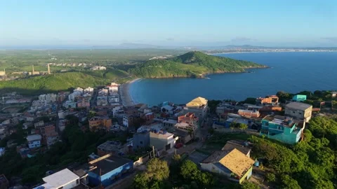Aerial Drone View of Prainha Beach, Coastal Town and Hills in Arraial do Cabo Stock Footage 345719260