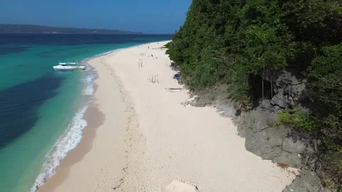 Aerial drone view of Puka Beach Boracay with turquoise water and white sand  Stock Footage 334050038