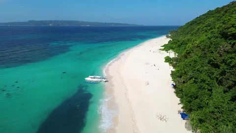 Aerial drone view of Puka Beach Boracay with turquoise water and white sand  Stock Footage 334050039