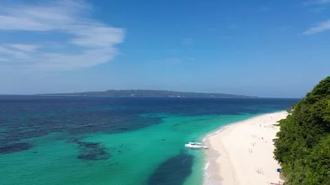 Aerial drone view of Puka Beach Boracay with turquoise water and white sand  Stock Footage 334050065