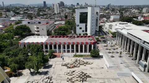 Aerial drone view pulling back from iconic Plaza Fuente sculpture in Guadalajara Stock Footage 328727472