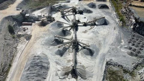 Aerial drone view of quarry processing plant with conveyor system Stock Photos