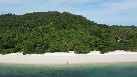 Aerial drone view of quiet beach and romantic couple walking white beach 4k Stock Footage 267694477