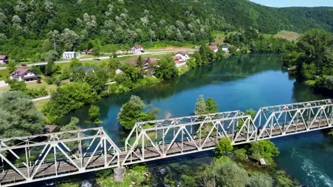 Aerial drone view of railway bridge crossing a river. Train bridge Stock Footage 336664585